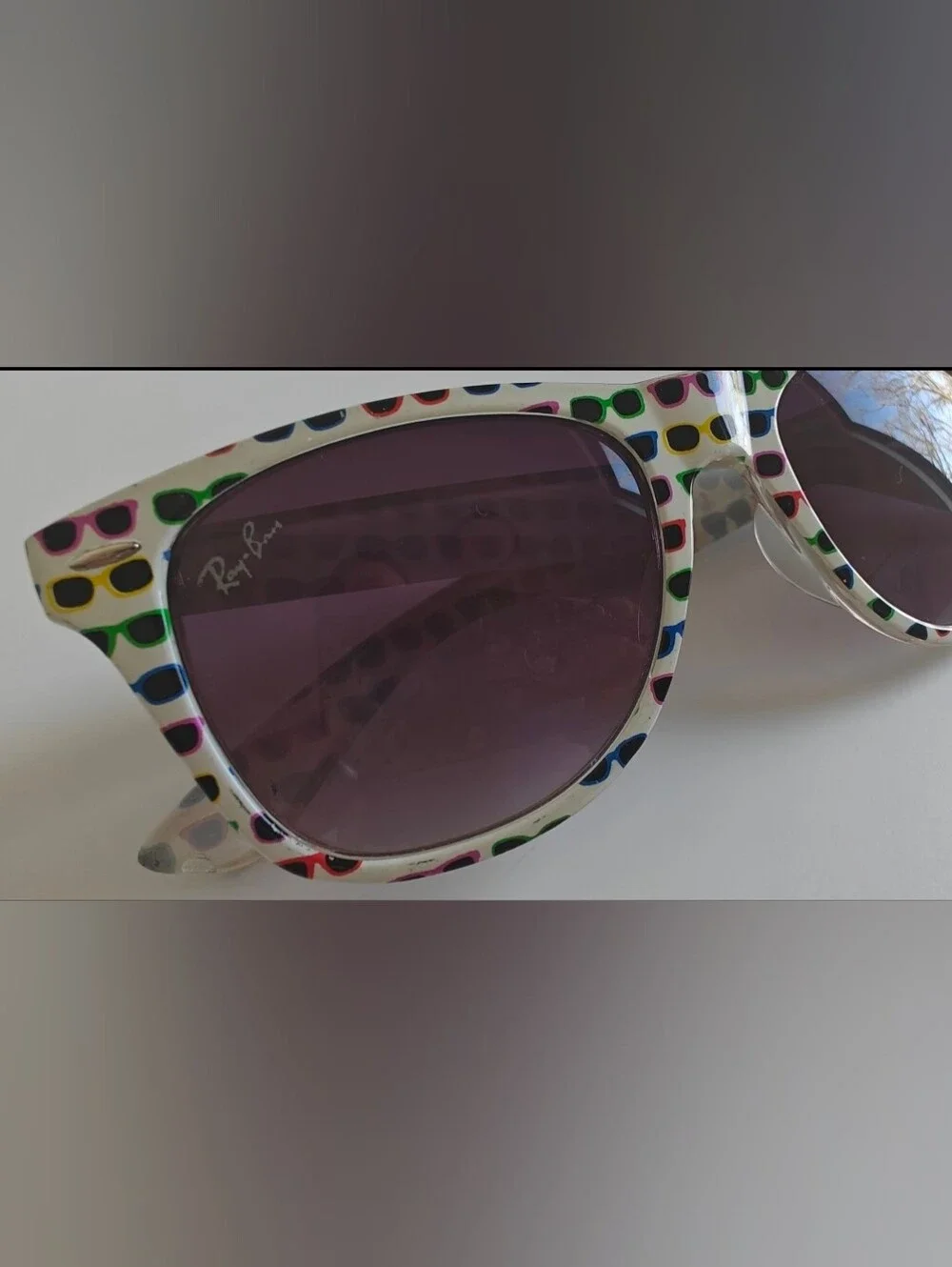 Ray-Ban Wayfarer Special Series #4 white frame covered in colorful sunglasses